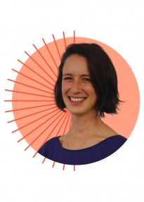 Smiling woman portrait with short dark hair, wearing a blue top, over an orange circular background with radiating lines.